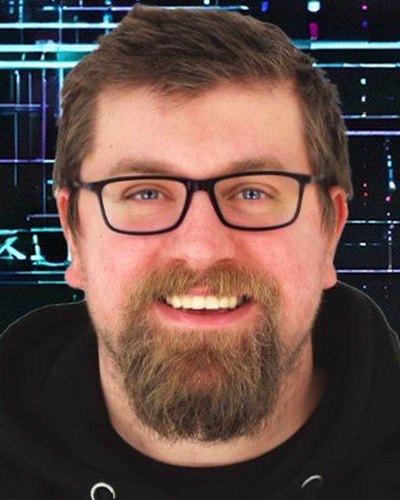 Alexander England of Helios Immersive, smiling, in glasses and a black hoodie